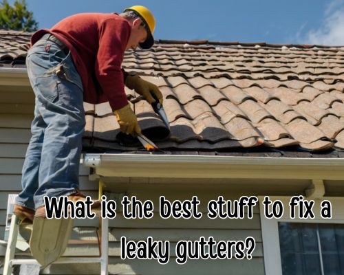 Worker fixing damaged roof gutter.